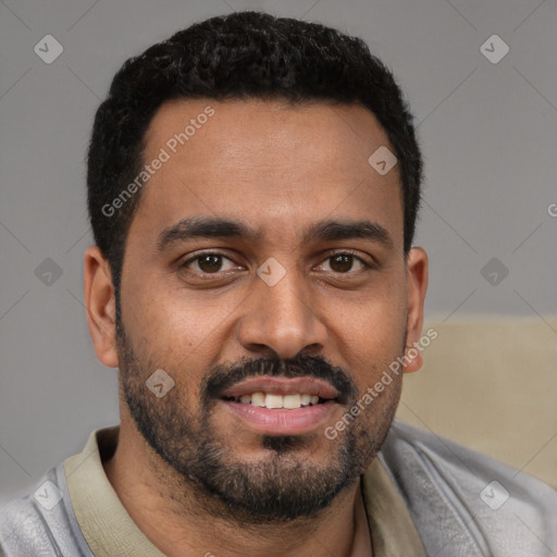 Joyful black young-adult male with short  black hair and brown eyes
