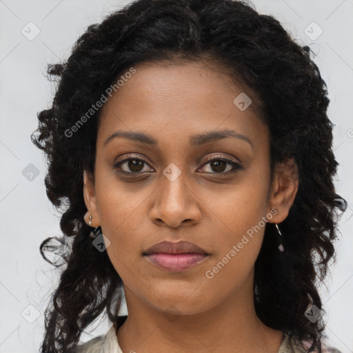 Joyful black young-adult female with long  brown hair and brown eyes