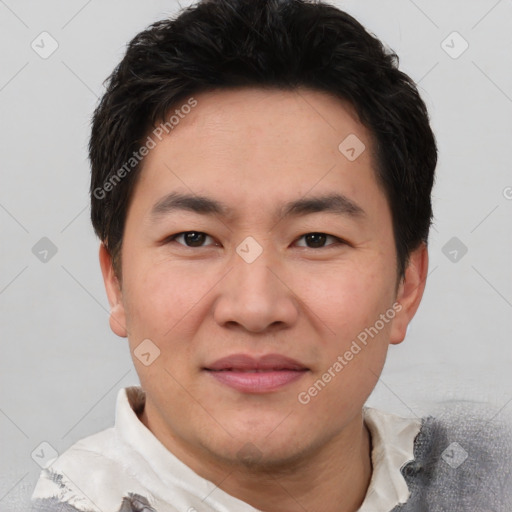 Joyful asian young-adult male with short  black hair and brown eyes