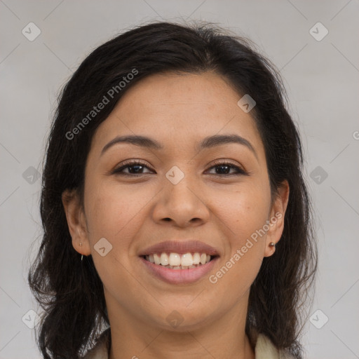 Joyful latino young-adult female with medium  brown hair and brown eyes