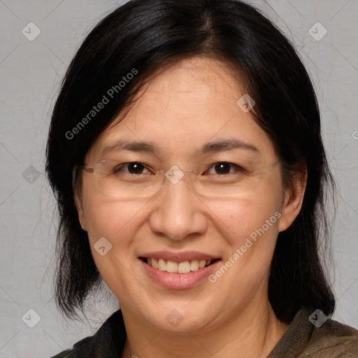 Joyful white adult female with medium  brown hair and brown eyes