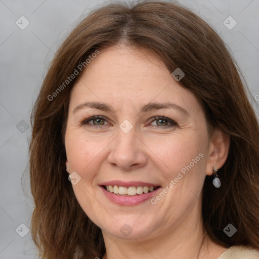 Joyful white adult female with medium  brown hair and brown eyes