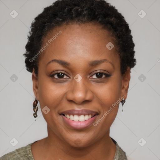 Joyful black young-adult female with short  brown hair and brown eyes