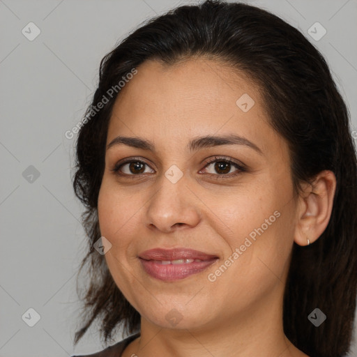 Joyful white adult female with medium  brown hair and brown eyes