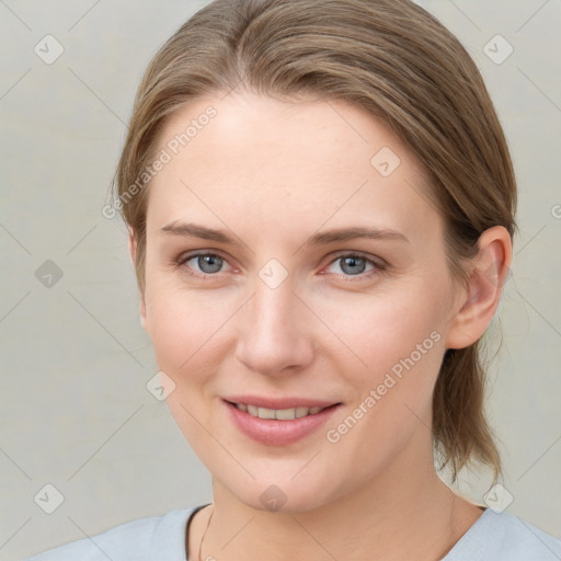 Joyful white young-adult female with medium  brown hair and blue eyes