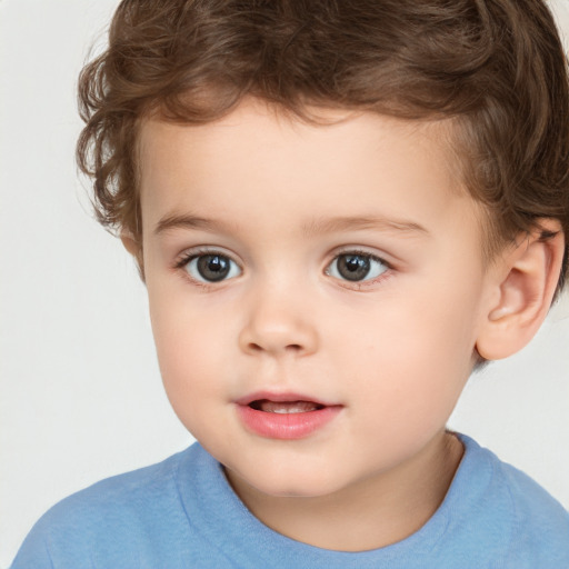 Joyful white child male with short  brown hair and brown eyes