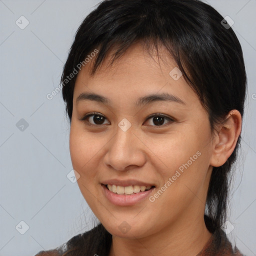 Joyful asian young-adult female with medium  brown hair and brown eyes