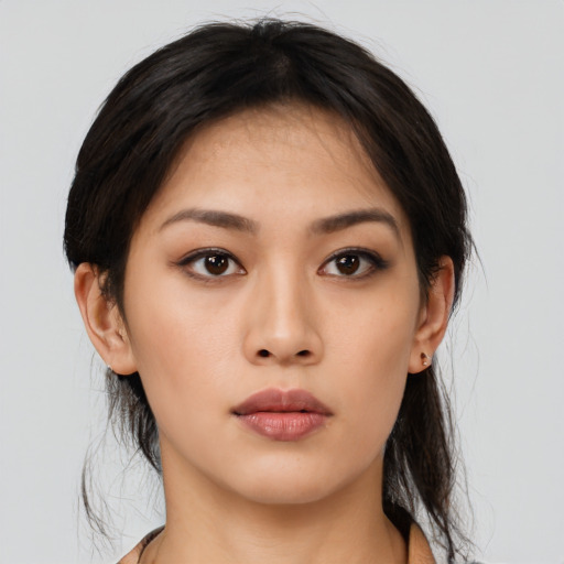 Neutral asian young-adult female with medium  brown hair and brown eyes