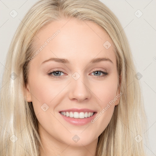 Joyful white young-adult female with long  brown hair and blue eyes