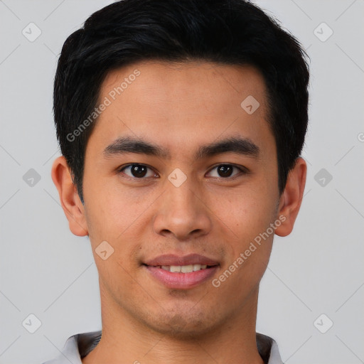 Joyful asian young-adult male with short  brown hair and brown eyes