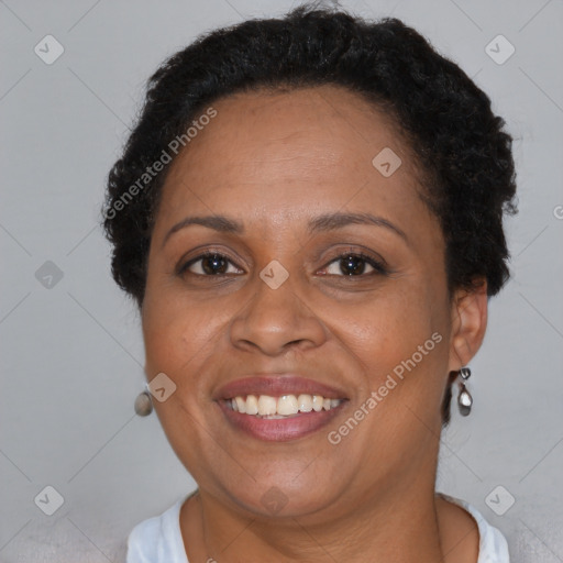 Joyful black adult female with short  brown hair and brown eyes