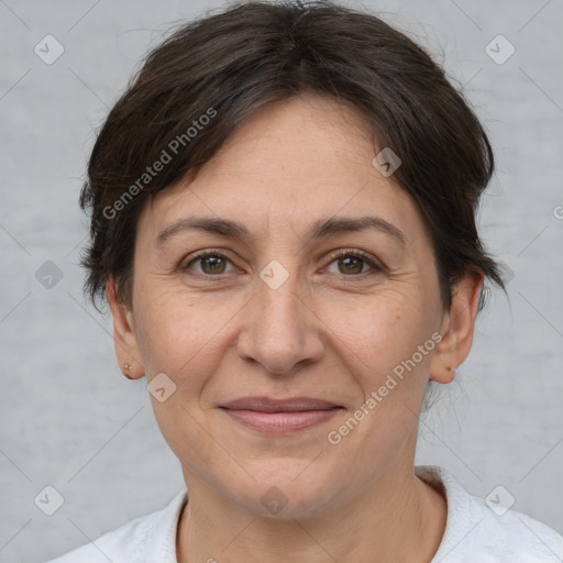 Joyful white adult female with short  brown hair and brown eyes