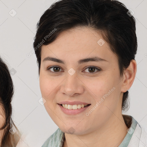 Joyful white young-adult female with medium  brown hair and brown eyes