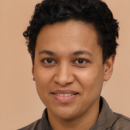 Joyful latino young-adult male with short  brown hair and brown eyes