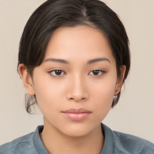 Neutral asian young-adult female with medium  brown hair and brown eyes