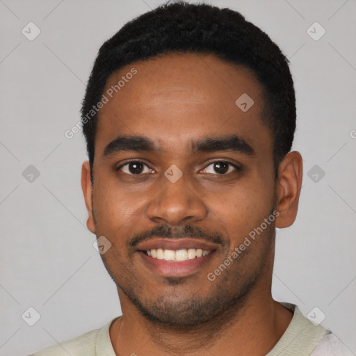 Joyful black young-adult male with short  black hair and brown eyes