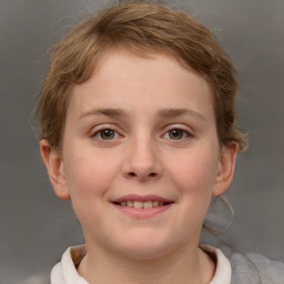 Joyful white child female with short  brown hair and brown eyes