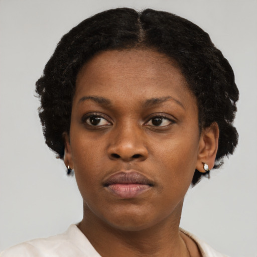 Neutral black young-adult female with short  black hair and brown eyes