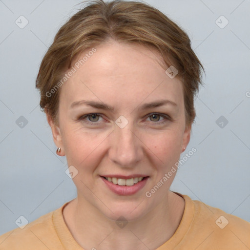 Joyful white young-adult female with short  brown hair and grey eyes