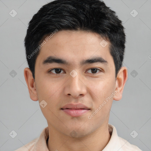 Joyful asian young-adult male with short  black hair and brown eyes