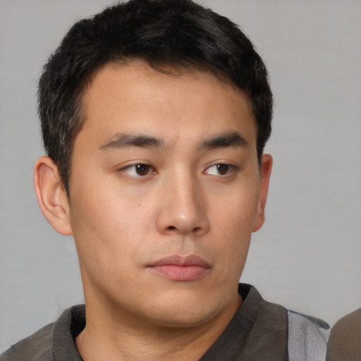 Neutral asian young-adult male with short  brown hair and brown eyes