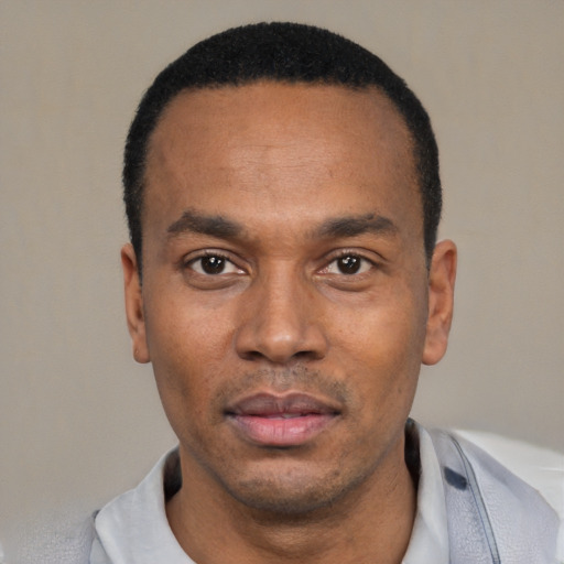 Neutral latino adult male with short  black hair and brown eyes