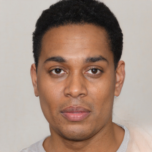 Neutral black young-adult male with short  black hair and brown eyes