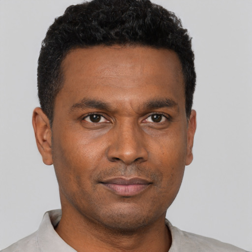 Neutral black young-adult male with short  brown hair and brown eyes