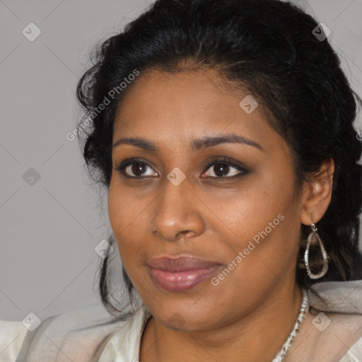 Joyful black young-adult female with long  brown hair and brown eyes