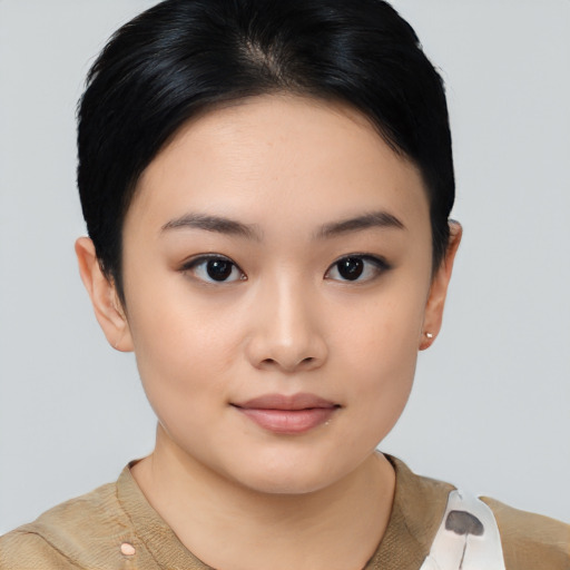 Joyful asian young-adult female with short  black hair and brown eyes