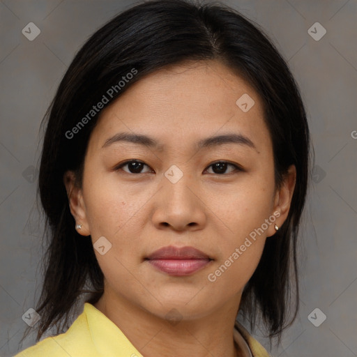 Joyful asian young-adult female with medium  brown hair and brown eyes