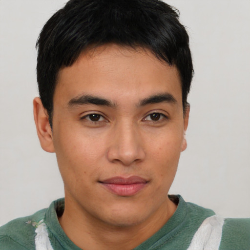 Joyful asian young-adult male with short  brown hair and brown eyes