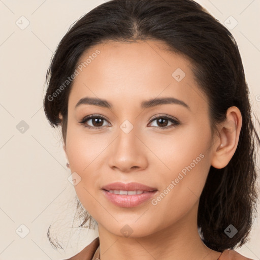 Joyful latino young-adult female with long  brown hair and brown eyes