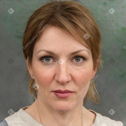 Joyful white adult female with medium  brown hair and grey eyes