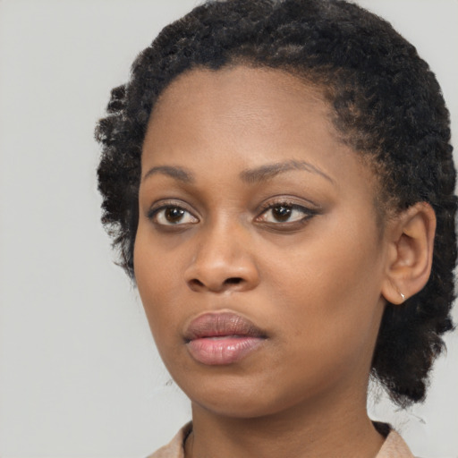 Neutral black young-adult female with medium  black hair and brown eyes