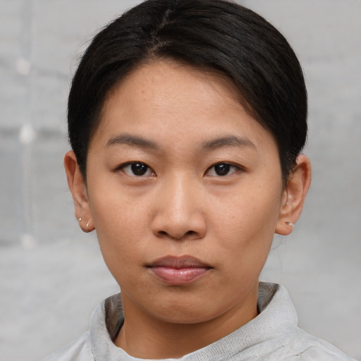 Neutral asian young-adult female with short  brown hair and brown eyes