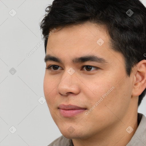 Joyful asian young-adult male with short  black hair and brown eyes