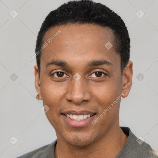 Joyful black young-adult male with short  black hair and brown eyes