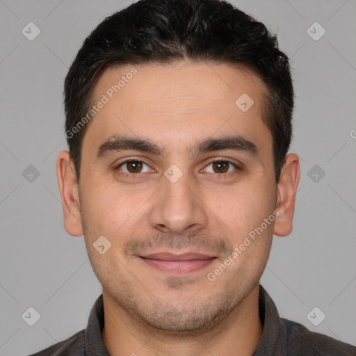 Joyful white young-adult male with short  brown hair and brown eyes