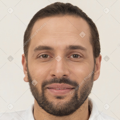 Joyful white young-adult male with short  black hair and brown eyes