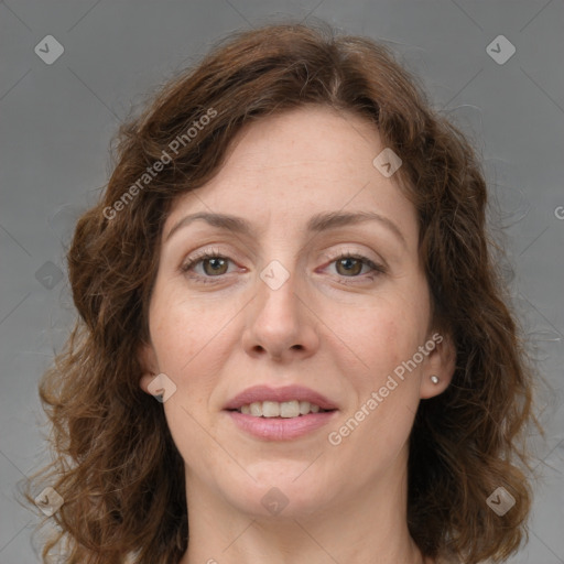 Joyful white adult female with medium  brown hair and green eyes