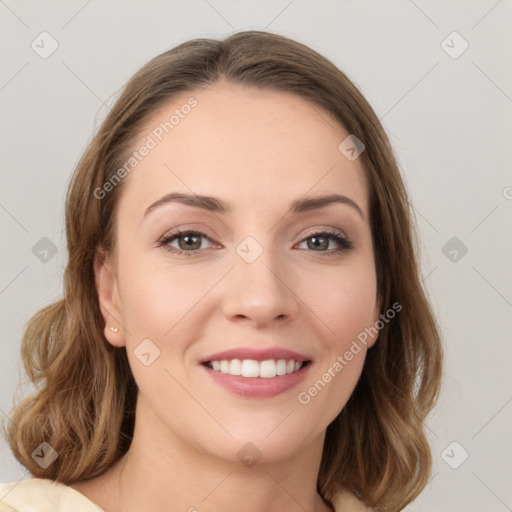 Joyful white young-adult female with medium  brown hair and green eyes