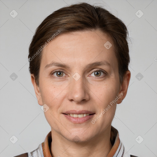 Joyful white adult female with short  brown hair and grey eyes