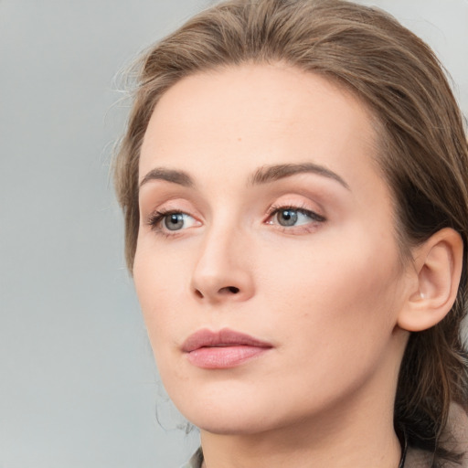 Neutral white young-adult female with long  brown hair and grey eyes