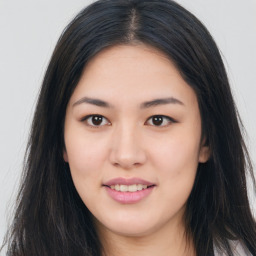 Joyful asian young-adult female with long  brown hair and brown eyes