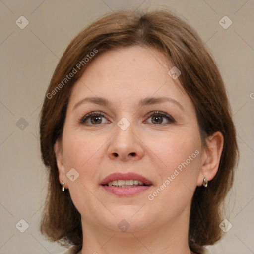 Joyful white adult female with medium  brown hair and brown eyes