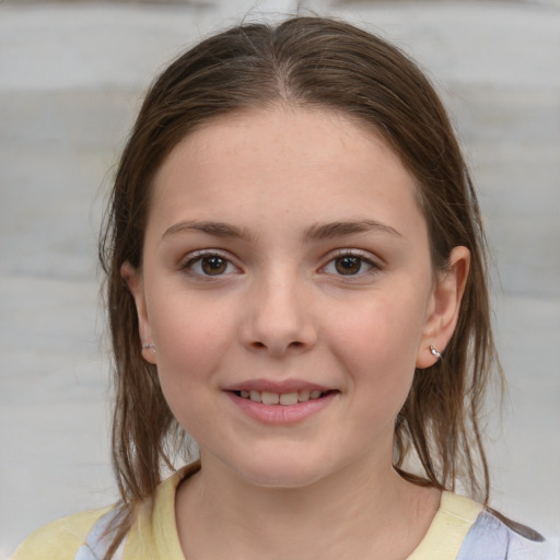 Joyful white child female with medium  brown hair and grey eyes
