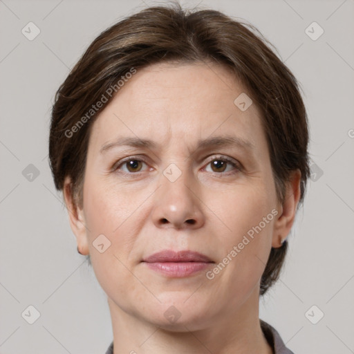 Joyful white adult female with medium  brown hair and grey eyes