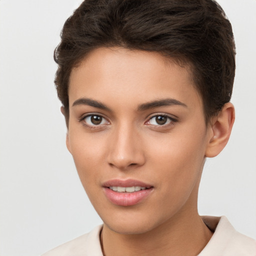 Joyful white young-adult female with short  brown hair and brown eyes