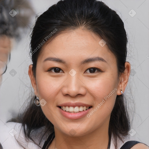 Joyful white young-adult female with medium  brown hair and brown eyes